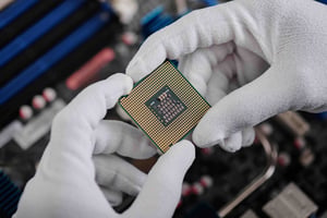 comp_close-up-of-computer-chip-held-in-gloves-2026-01-07-23-55-05-utc